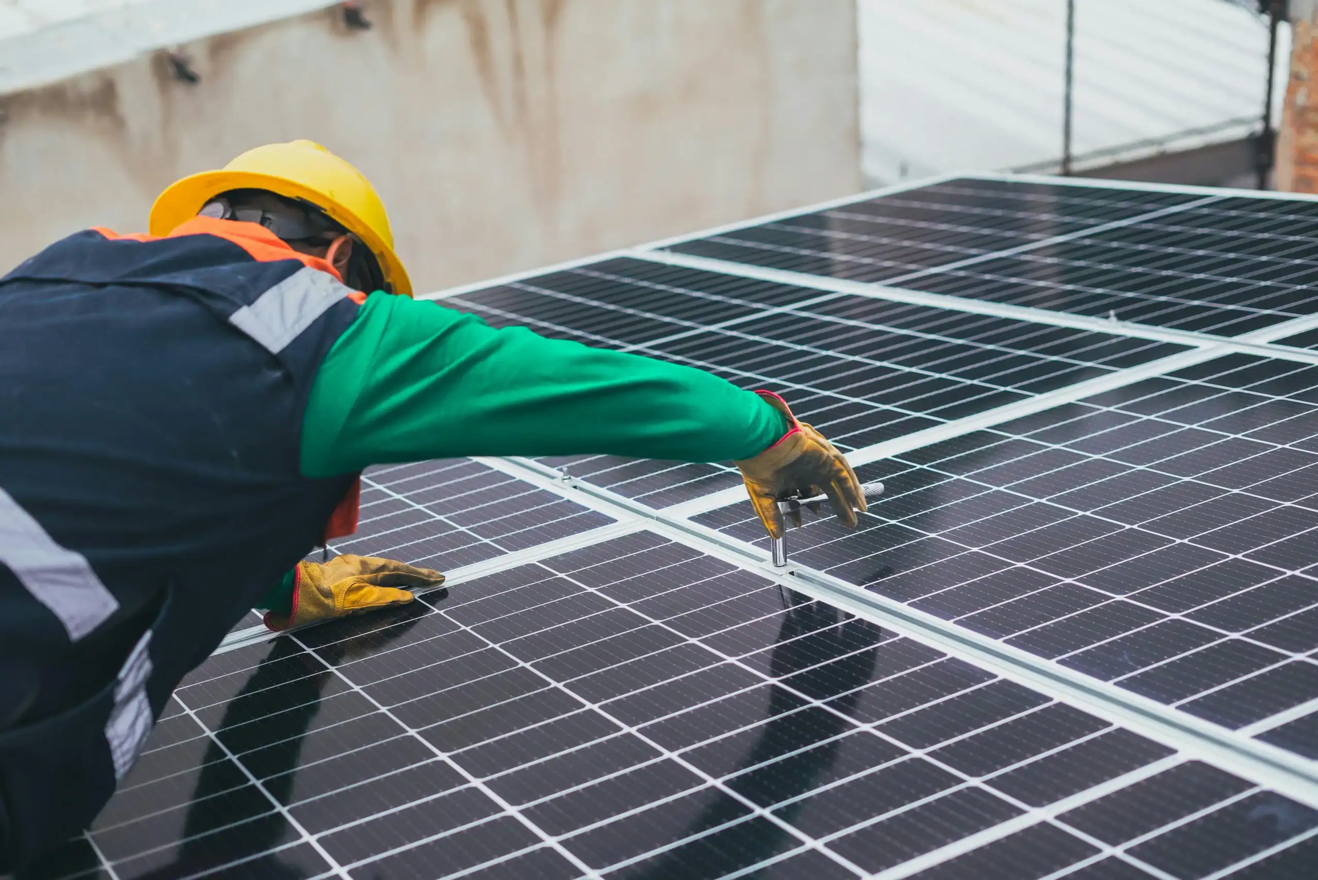 Technician inspecting solar panels