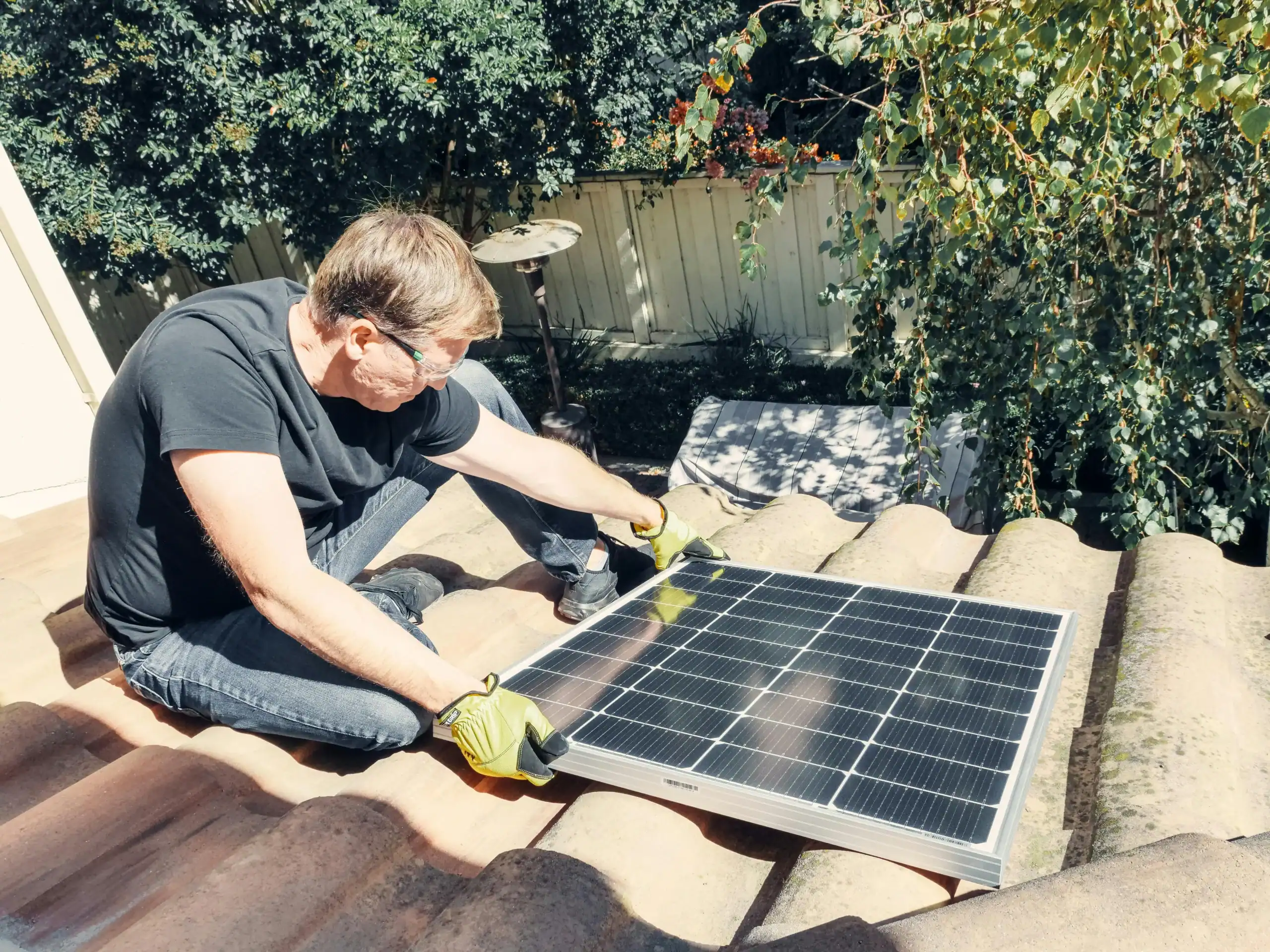 a man is installing solar panel
